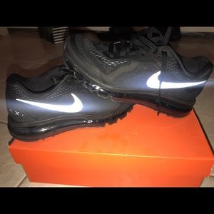Black Nike Air Maxes with reflector logo